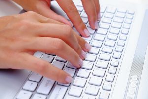 fingers-typing-on-laptop-keyboard