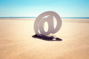 out of office responder an email symbol at the beach