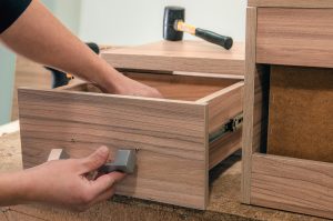 desk drawer being opened and tested during assembly