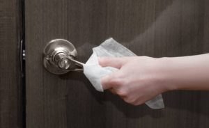 using a tissue to open doors during covid-19