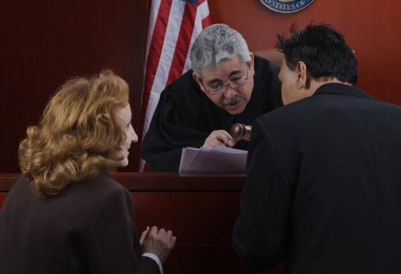 judge and attorney in a discussion`