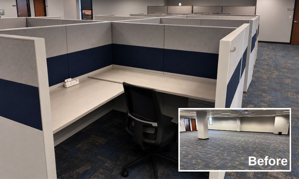 A newly installed row of modern L-shaped office cubicles featuring grey and navy fabric privacy panels, light wood surfaces, and an ergonomic black chair, with an inset picture showing the completely empty, bare carpeted floor beforehand.