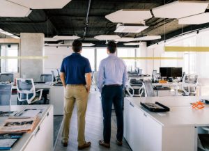 A Project manager from Office Furniture EZ and a client doing a final walk through of a new furnshing job ahead of move-in day.