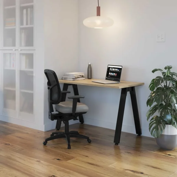 A single ergonomic office chair and a table desk