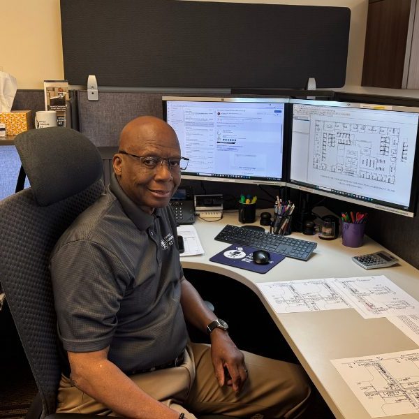 Office Furniture EZ Design Consultant Will Garth in his office at the Denver HQ preparing a 2D site plan